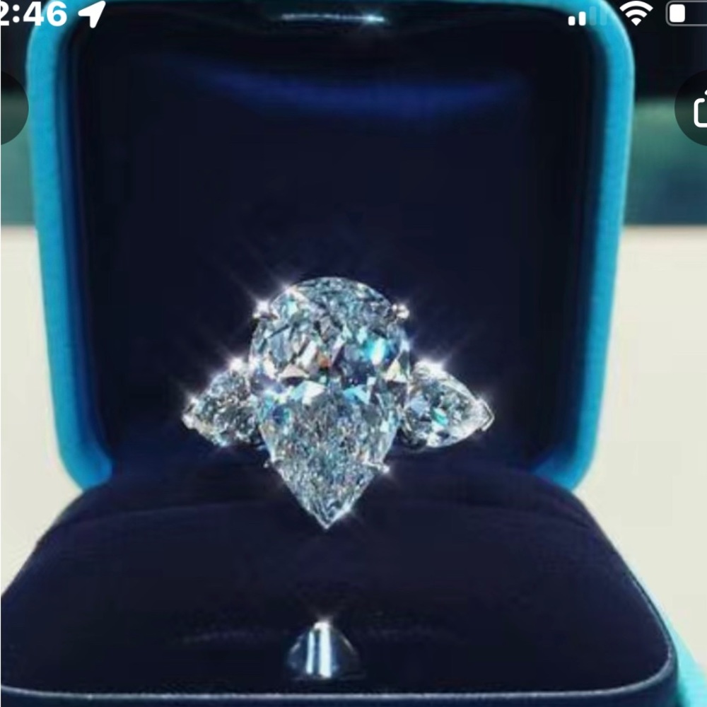 Pretty sliver tone ring with zirconia stone with blue tint to it size7